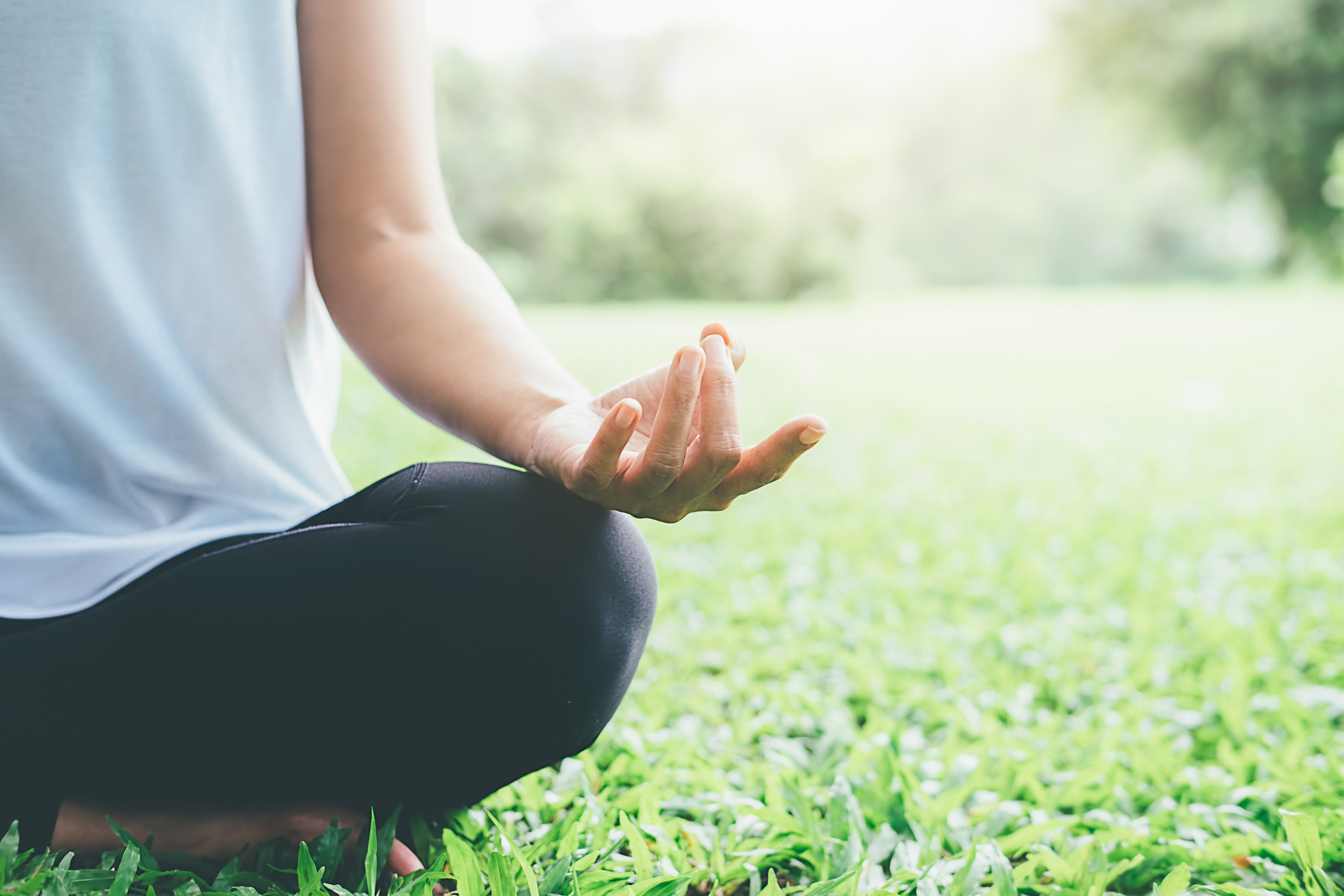 Woman holding yoga position outside